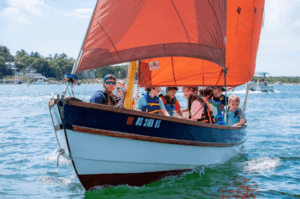The Drascombe Gig under sail in Onset Bay
